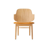 The Penguin Wooden Lounge Chair in natural oak with an orange Aida 0250 upholstered seat, shown from the front.
