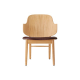 The Penguin Wooden Lounge Chair in natural oak with a dark brown Aida 0329 upholstered seat.