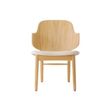 The Penguin Wooden Lounge Chair in natural oak with a light beige textured upholstered seat, seen from the front.