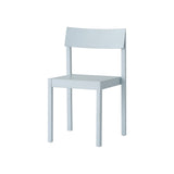 Linen blue Mauro Dining Chair featuring a solid wood frame and curved veneer seat, shown at an angle.