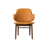 The Penguin Wooden Lounge Chair with a red-stained oak frame and orange Aida 0250 upholstery, shown from the front.