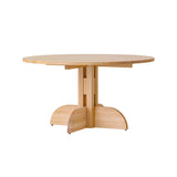The Puffin Dining Table, Round, crafted from solid natural oak with a circular top and architectural pedestal base.