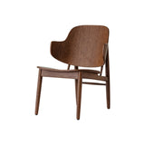 The red-stained oak Penguin Wooden Lounge Chair features a curved form-pressed veneer back and mid-century silhouette.