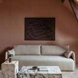 A light grey Offset Sofa against a terracotta wall below an abstract painting, with marble Plinth tables and a Column Lamp.