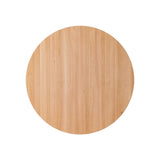 Overhead view of the round Puffin Dining Table in natural solid oak, highlighting the organic wood grain texture.