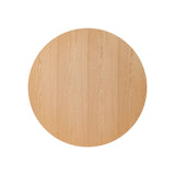 Top-down view of the round Puffin Dining Table, showcasing the natural oak grain and smooth circular tabletop.